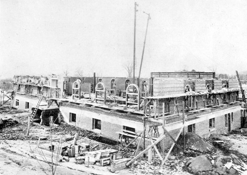 87 Gym April 1912 – masonry completed to second story – girders for the second floor in place.