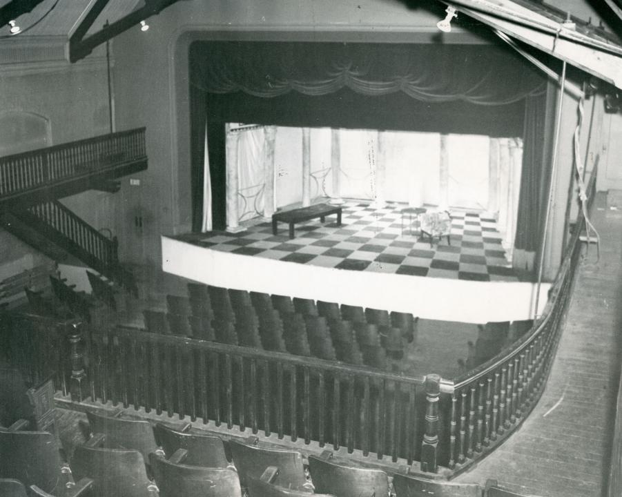 Stage floor, balcony in forefront, old running track on the right