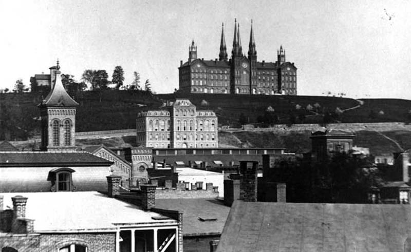 Main Building in center and Proudfit in background behind the steeple, 1900. Troy University building dominates the skyline.