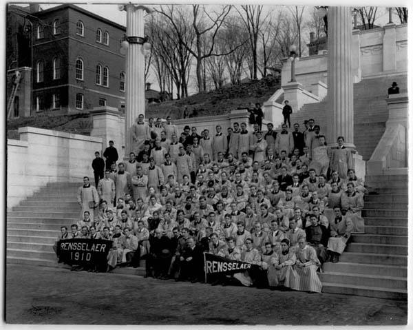 Photograph showing Rensselaer's Class of 1910 sitting at the bottom of the Approach steps, with instructors shown standing to left in photo as well as behind the students