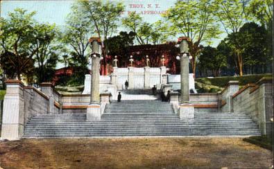 Early color-tinted photograph of The Approach, looking up the hill toward Eighth Street. People standing near the top of the steps, with what is believed to be the Main Building in distance (date unknown)