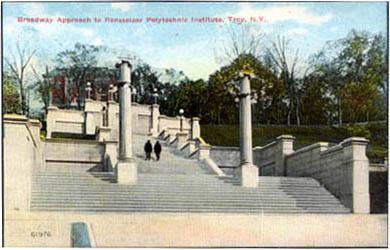 Early color-tinted photo/postcard showing two people walking up the Approach steps (view looking uphil, facing east-southeast; date unknown)