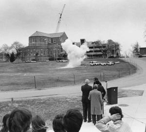 Photo depicting the small underground explosion that took place during the JEC's unique groundbreaking (April 18, 1975)