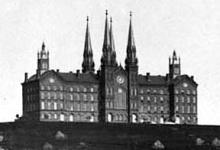 Distant exterior view of the original Troy Univsersity Building, shown atop the hillside overlooking Troy (west-northwest elevation, date unknown)