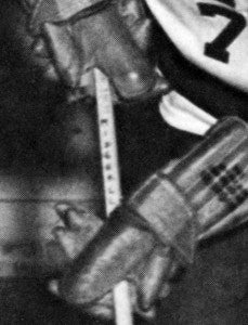 This detail from a 1959 Transit photo faintly shows Paul Midghall’s last name lettered near the top of his hockey stick