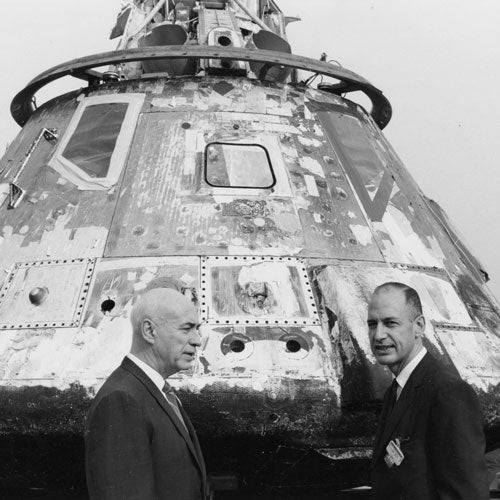 George Low in front of Apollo 11 command module