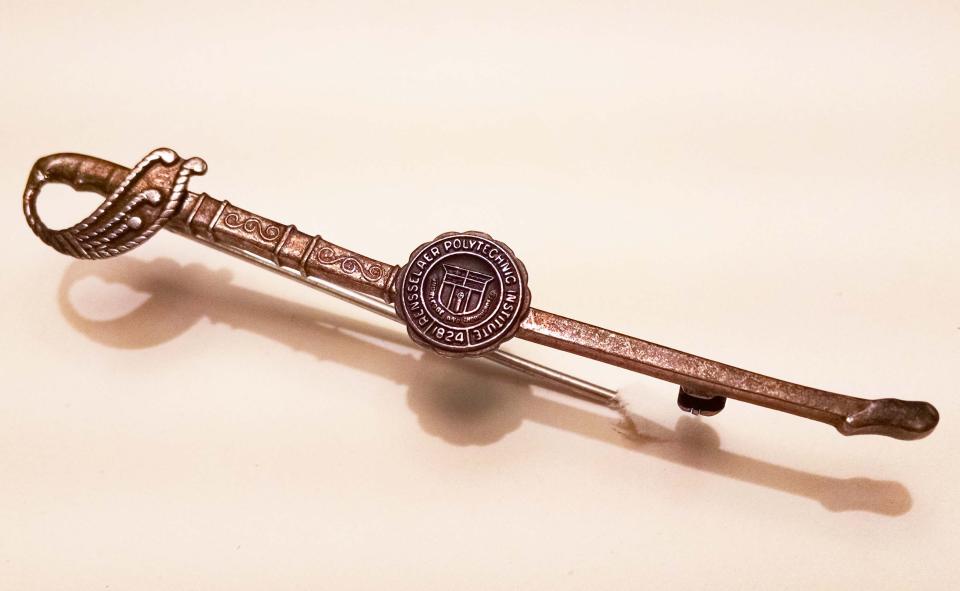 Sword shaped pin, RPI seal in the middle, 2.75″ long.