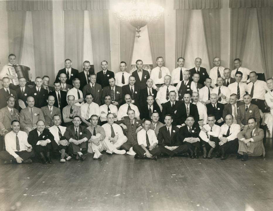 Indoor photo showing a gathering of the Class of 1913 during their 1938 (25 year) reunion
