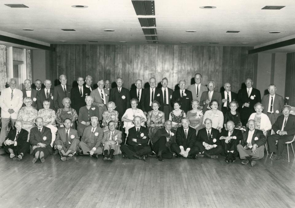 Indoor photo of the Class of 1913 during their 1963 (50 year) reunion