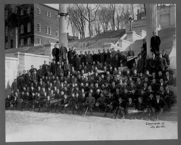 Photograph showing Rensselaer's Class of 1911 sitting at the bottom of the Approach steps, with instructors shown standing to left in photo as well as behind the students