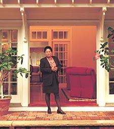 Dr. Jackson standing in the entrance of the original President's House on upper Tibbets Avenue (circa 1999)