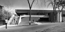 Exterior view of the Darrin Communication Center, with students shown walking outside the building (west elevation angled slightly upwward, date unknown)