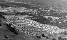Aerial photograph of Rensselaerwyck housing development, probably circa 1946 (looking south-southwest; Armory and other campus buildings visible, with Hudson River in distance)